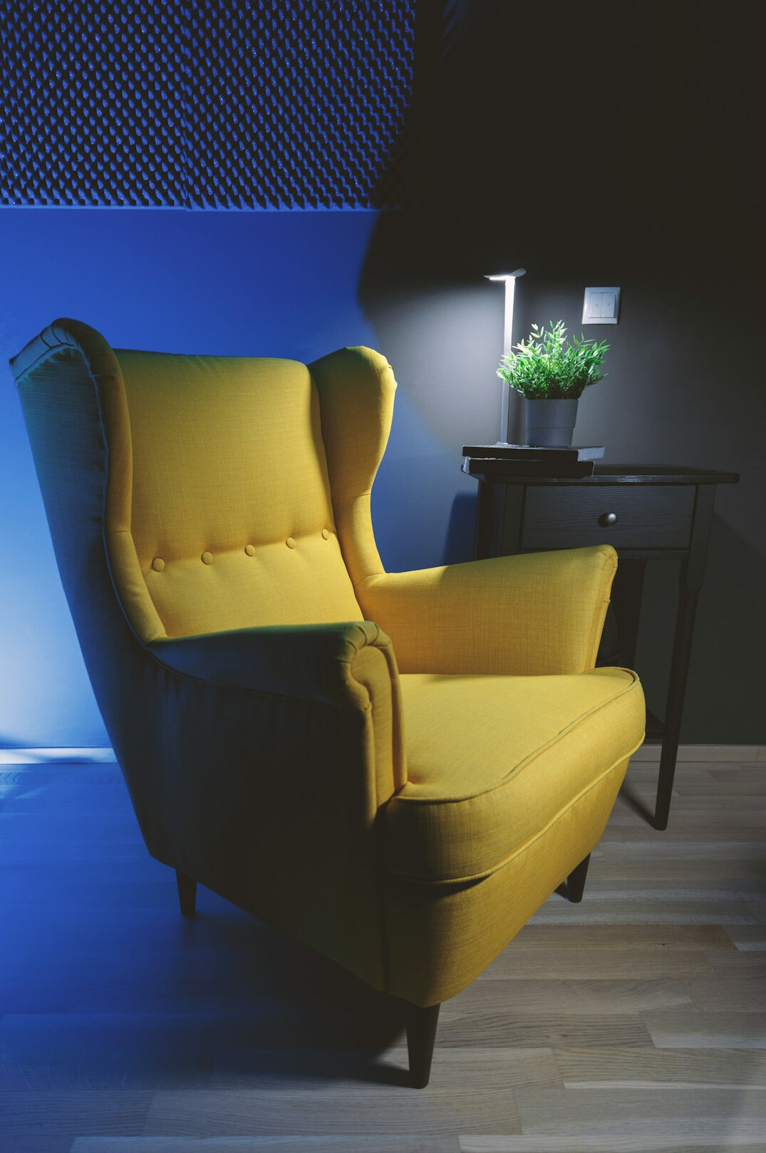 Cozy reading corner with bookshelves and soft lamp light