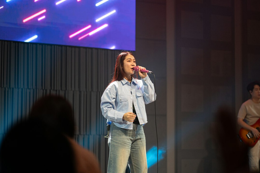 woman speaking confidently on stage