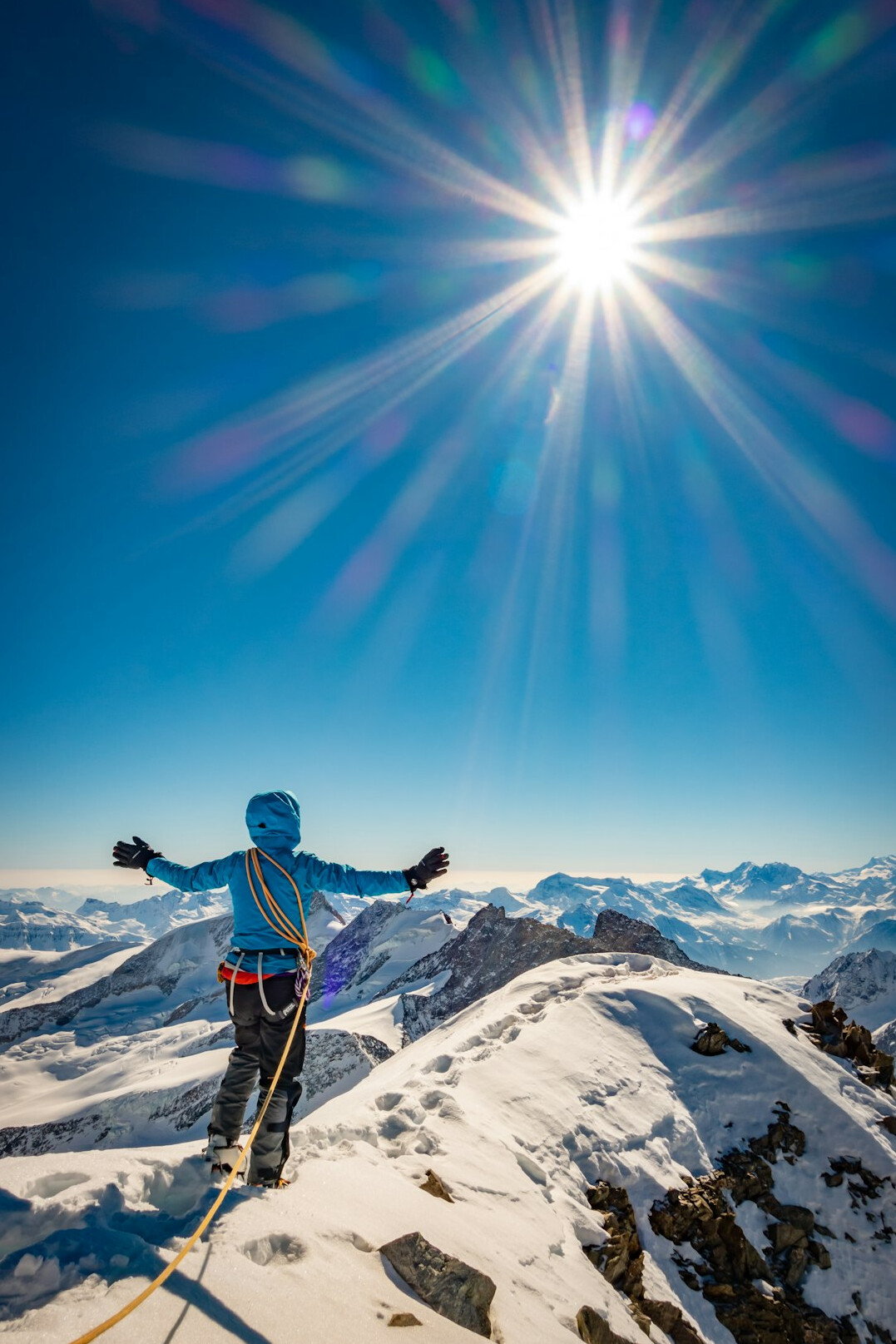 person climbing mountain